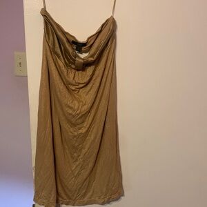 A stretchy dress with some shimmer and haves a silk top.